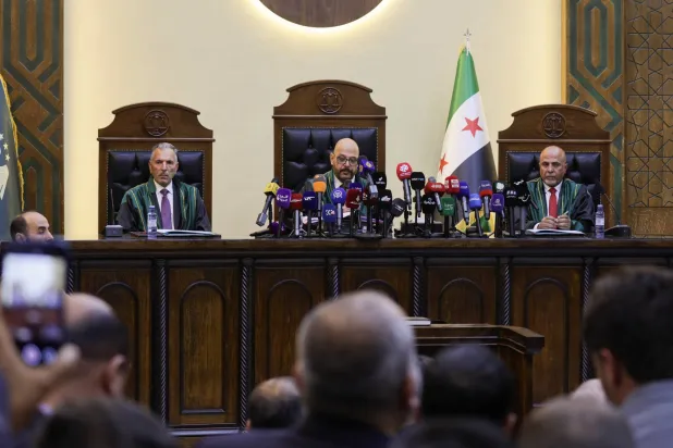 Judges attend a trial session of Atef Najib, a brigadier general and former head of the Political Security Department in Daraa during Syria's ousted President Bashar al-Assad's rule, who is accused of committing war crimes, at the Palace of Justice, in Damascus, Syria, April 26, 2026. REUTERS/Khalil Ashawi