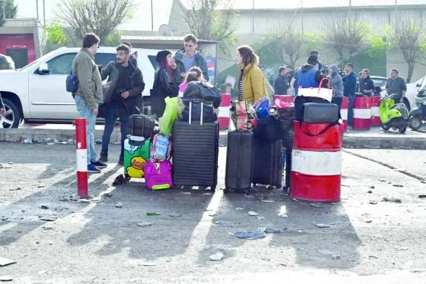 Syrian refugees in Lebanon return to their country through the Masnaa crossing after the fall of the Syrian regime in December 2024. (EPA)