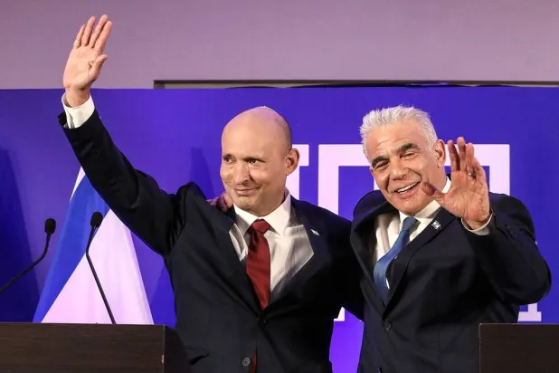 Former Israeli Prime minister Naftali Bennett and Israeli opposition leader Yair Lapid gesture as they announce their political union ahead of this year's general election, the new party will be called "Together", in Herzliya, Israel April 26, 2026. (Reuters) 