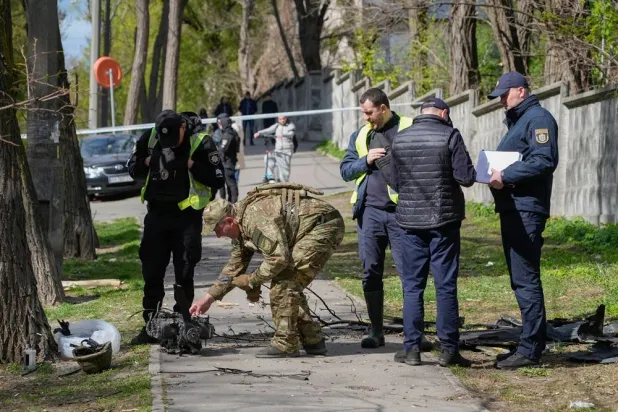 Police officers inspect fragments of a Russian drone after an air attack in Kyiv, Ukraine, Tuesday, April 28, 2026. (AP) 