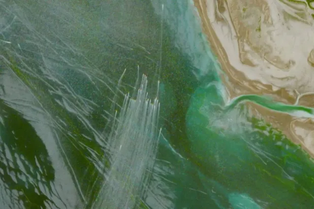 A satellite image shows small boats north of the Strait of Hormuz. (Reuters) 