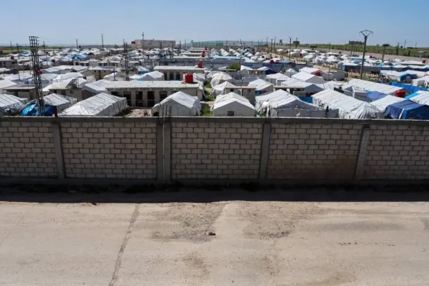 A brick wall surrounds a tent camp housing people with alleged ties to ISIS militants at Roj Camp in eastern Syria, Friday, April 24, 2026. (AP)
