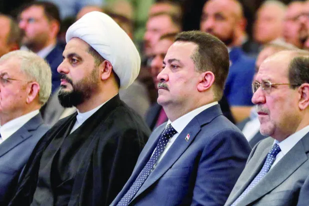 
أرشيفية تجمع نوري المالكي ومحمد السوداني وقيس الخزعلي ولطيف رشيد خلال اجتماع في بغداد (أ.ف.ب)