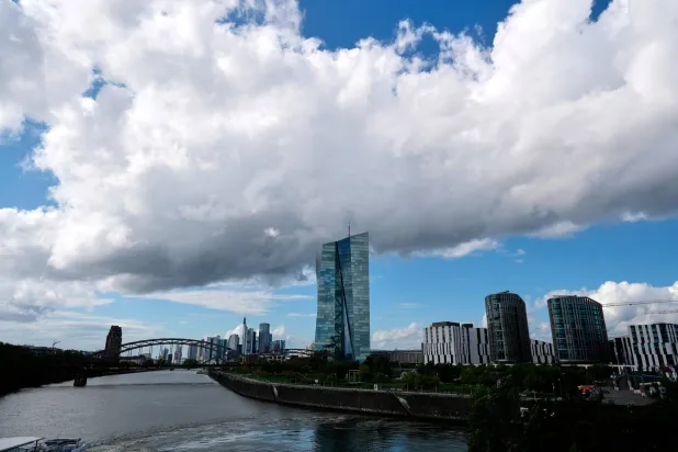 FILE -Clouds cover the sky over the headquarters of the European Central Bank in Frankfurt, Germany, Sept. 11, 2025. (AP Photo/Michael Probst, File)