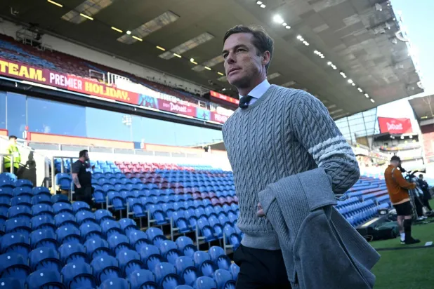 (FILES) Burnley's English manager Scott Parker arrives before the English Premier League football match between Burnley and Manchester City at Turf Moor in Burnley, north-west England on April 22, 2026. (Photo by Paul ELLIS / AFP) 