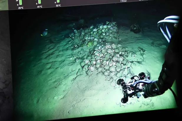 This photograph shows a screen displaying live footage of the CAMARA 4 wreck and its cargo, transmitted by the “ROV C 4000”, a remotely operated vehicle manufactured by the French company LD Travocean and designed for seabed exploration, during an archaeological mission on the CAMARA 4 wreck from the bridge of the (BSAA) Jason, off the coast of Ramatuel, in southeastern France on April 7, 2026.  (Photo by Thibaud MORITZ / AFP)