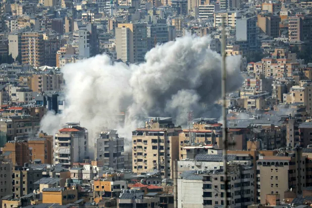 Smoke rises from the site of an Israeli strike in Beirut's southern suburbs, on April 5, 2026. (AFP)