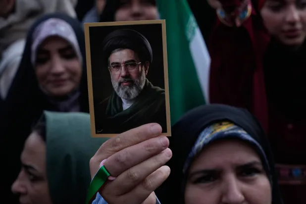 A woman holds up a picture of the Iranian Supreme Leader Mojtaba Khamenei during a state-organized rally in Tehran, Iran, Wednesday, April 29, 2026. (AP) 