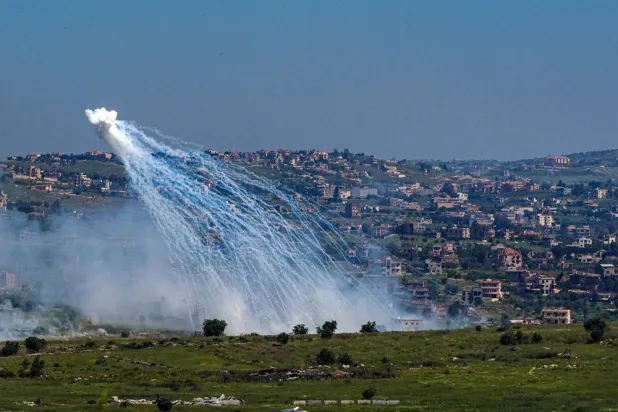 An explosion of what appears to be white phosphorus fired by the Israeli army on the Lebanese side of the Israel-Lebanon border as seen from the Israeli side of the border, April 30, 2026. (Reuters) 