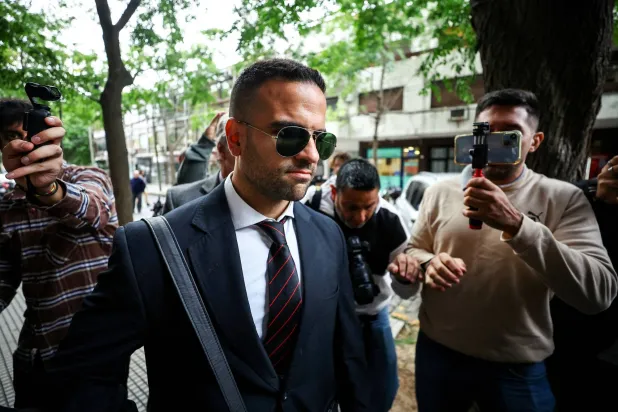 FILE PHOTO: Psychologist Carlos Angel Diaz walks on the day of a court case against people charged in connection with the death of Argentine soccer player Diego Maradona, in Buenos Aires, Argentina, March 11, 2025. REUTERS/Agustin Marcarian/File Photo