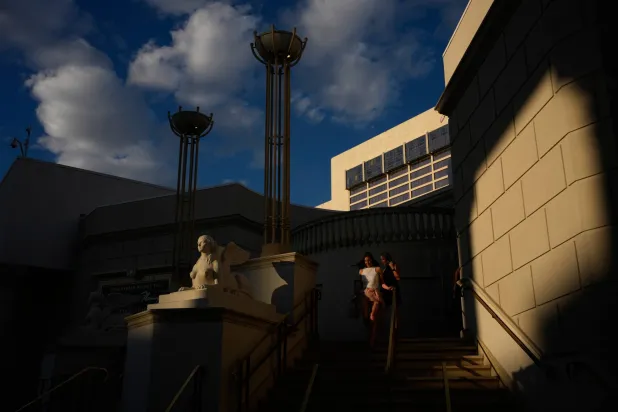 People walk near Caesars Palace along the Las Vegas Strip, Thursday, April 30, 2026, in Las Vegas, Nevada. (AP Photo/John Locher)