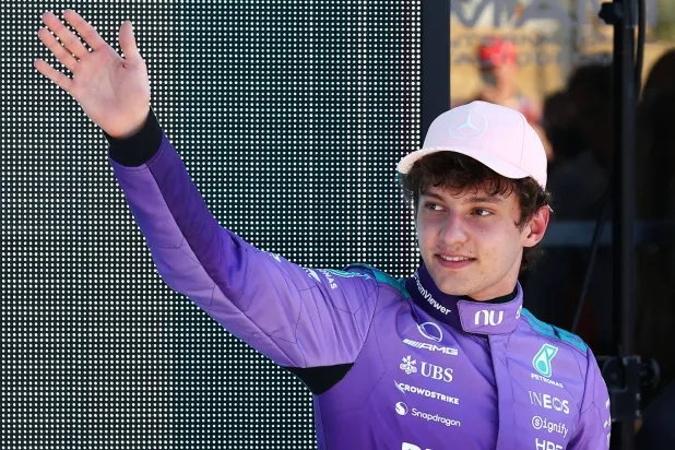 Mercedes' Italian driver Kimi Antonelli waves after winning the pole position during the qualifying session for the 2026 Miami Formula One Grand Prix at Miami International Autodrome in Miami Gardens, Florida, on May 2, 2026. (Photo by CHARLY TRIBALLEAU / AFP)