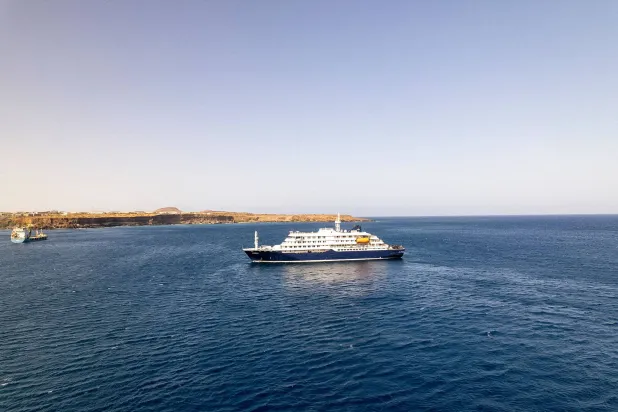 This aerial picture shows a general view of the cruise ship MV Hondius stationary off the port of Praia, the capital of Cape Verde, on May 3, 2025. (AFP)