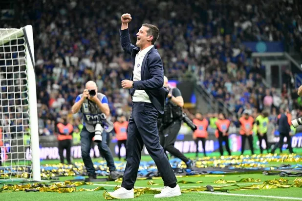 Inter Milan's Romanian head coach Cristian Chivu celebrates after winning the 21st "scudetto" following the Italian Serie A football match between Inter Milan and Parma at San Siro stadium in Milan, on May 3, 2026. (AFP) 