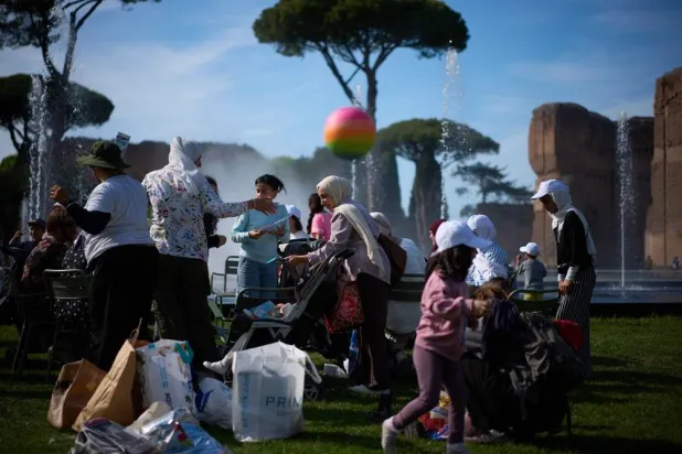  Families of Palestinian refugees who have arrived in Italy from the Gaza Strip through humanitarian corridors due to serious medical reasons, take part in a visit to Rome's Baths of Caracalla offered by the "Guides for Gaza" association, Sunday, May 3, 2026. (AP) 