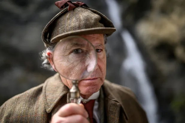 British motoring author Philip Porter, dressed as Sherlock Holmes poses during a visit by members of the Sherlock Holmes Society of London to the Reichenbach Falls near Meiringen on May 3, 2026. (AFP)