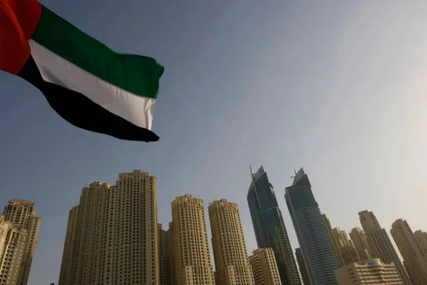  The United Arab Emirates flag flies in front of the Jumeirah Beach Residence in Dubai. (Reuters file photo) 