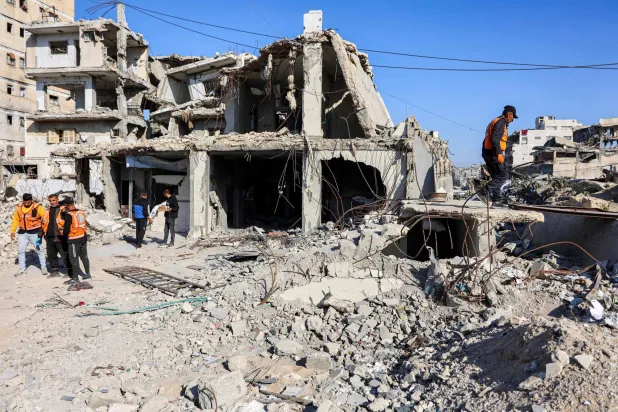  First responders inspect the site of an Israeli strike on a police station in Gaza City on May 5, 2026. (AFP) 