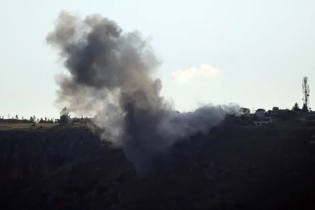 This photograph taken from the southern Lebanese area of Marjeyoun shows smoke as it rises from the site of an Israeli airstrike that targeted the village of Arnoun on May 6, 2026. (AFP)