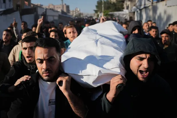  Palestinians carry the body of Naseem al-Kalazani, who was killed in an Israeli strike, during his funeral at Nasser Hospital in Khan Younis, southern Gaza Strip, Wednesday, May 6, 2026. (AP) 