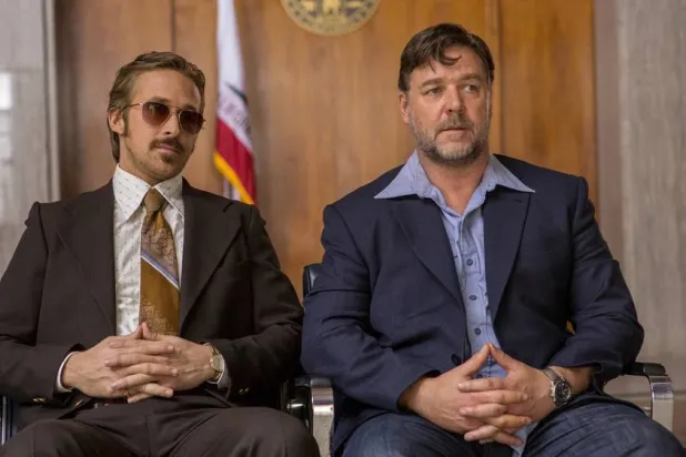 This image released by Warner Bros. shows Ryan Gosling, left, and Russell Crowe in a scene from "The Nice Guys." (Daniel McFadden/Warner Bros. via AP) 