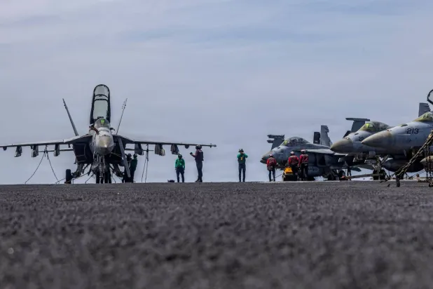 This US Navy handout photo released on May 4, 2026, by US Central Command Public Affairs shows US sailors conducting maintenance on the flight deck of the Nimitz-class aircraft carrier USS Abraham Lincoln (CVN 72) at sea on April 15, 2026. (Photo by US NAVY / AFP)
