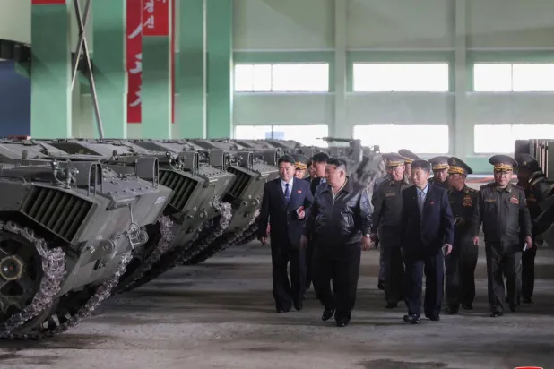 This picture taken on May 6, 2026 and released by North Korea's official Korean Central News Agency (KCNA) via KNS on May 8, 2026 shows North Korean leader Kim Jong Un (C) visiting a munitions factory to inspect the production status of military hardware at an undisclosed location in North Korea. STR / KCNA VIA KNS/AFP
