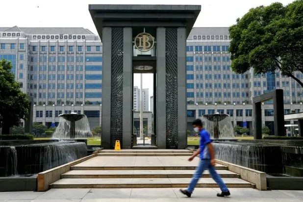 A man walks past Bank Indonesia headquarters in Jakarta, Indonesia, September 2, 2020. REUTERS/Ajeng Dinar Ulfiana