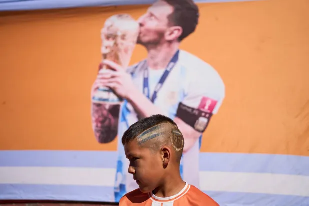 Soccer player Gianfranco Alegre, 8, poses for the picture prior to a match at the Grandoli club, where soccer star Lionel Messi played as a child in Rosario, Argentina, Saturday, May 2, 2026. (AP Photo/Rodrigo Abd)