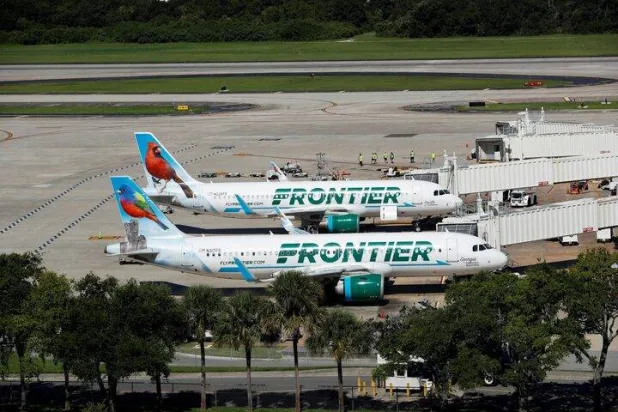 Frontier airlines planes are parked at the boarding gates at Tampa International Airport in Tampa, Florida, US, July 19, 2024. REUTERS/Octavio Jones/File Photo 