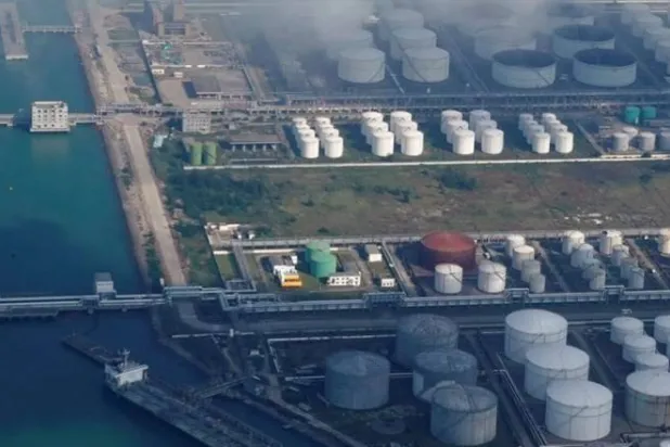 Oil and gas tanks are seen at an oil warehouse at a port in Zhuhai, China October 22, 2018. REUTERS/Aly Song