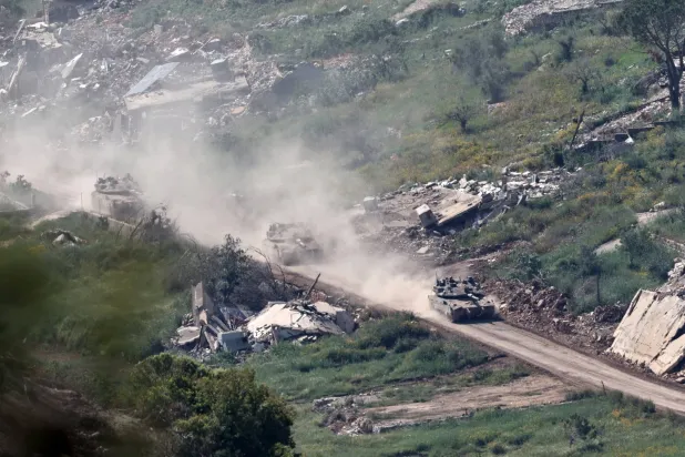 Israeli troops maneuver on the Lebanese side of the border, as seen from the Upper Galilee in northern Israel, 08 May 2026, amid a ceasefire between Israel and Lebanon.  EPA/ATEF SAFADI