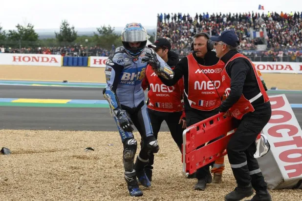 Gresini Racing MotoGP rider Alex Marquez of Spain is helped after crashing during the MotoGP race at the French Motorcycling Grand Prix in Le Mans, France, 10 May 2026. (EPA)