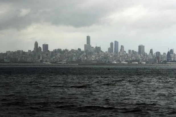 A picture taken from the seaside promenade of the northern Lebanese coastal town of Dbayeh shows the skyline of the Lebanese capital Beirut on March 17, 2020. (AFP)