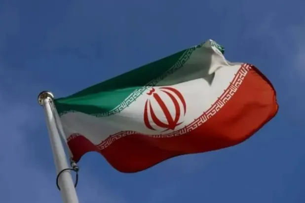 The Iranian flag waves in front of the International Atomic Energy Agency (IAEA) headquarters, before the beginning of a board of governors meeting, amid the coronavirus disease (COVID-19) outbreak in Vienna, Austria, March 1, 2021. (Reuters)

