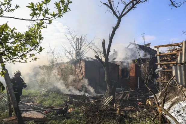 Ukrainian rescuers work at the site of a Russian strike on a private building in Kharkiv, northeastern Ukraine, 06 May 2026. (EPA)