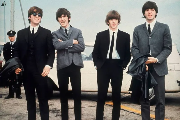 The Beatles, from left, John Lennon, George Harrison, Ringo Starr and Paul McCartney, arrive in Liverpool, England on July 10, 1964, for the premiere of their movie "A Hard Day's Night." (AP) 