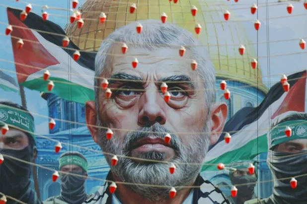 A billboard of Hamas' slain leader Yahya Sinwar is displayed at the Palestine square in Tehran, Iran, 19 October 2024. EPA/ABEDIN TAHERKENAREH