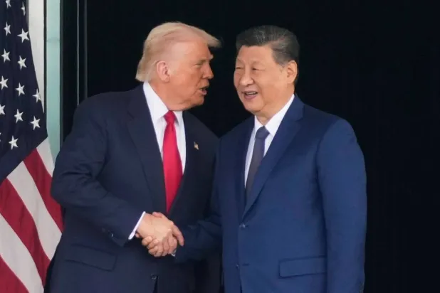 President Donald Trump, left, and Chinese President Xi Jinping, shake hands after their US-China summit talk at Gimhae International Airport Jinping in Busan, South Korea, Oct. 30, 2025. (AP)