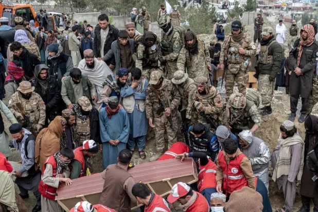 Victims of a strike on a drug rehab center in Kabul are burried in a mass grave on Badam Bagh Hilltop on March 26. Wakil KOHSAR / AFP/File