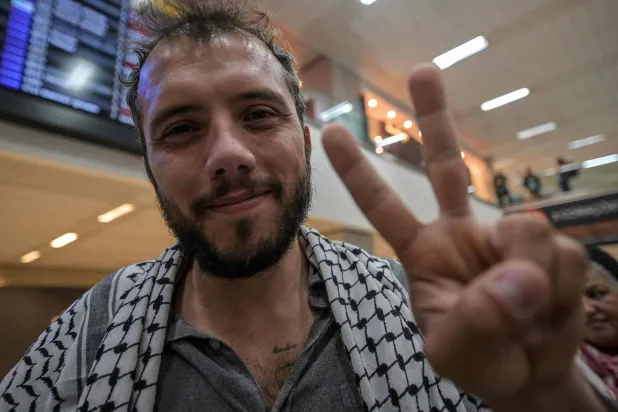  Brazilian activist Thiago Avila, a member of the Global Sumud flotilla, arrives at Guarulhos International Airport in Sao Paulo, Brazil, on May 11, 2026. (AFP) 