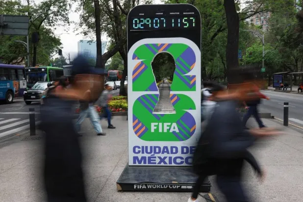  People walk past a sign that counts down the time until the tournament kicks off, ahead of the World Cup starting on June 11, in Mexico City, Mexico, May 11, 2026. (Reuters)
