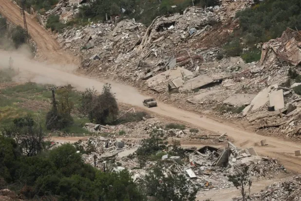 An Israeli military vehicle moves inside Lebanese territory (Reuters)
