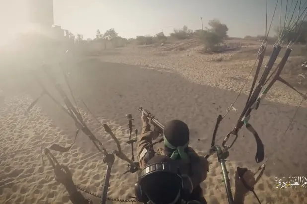 A still from a video published by Hamas's military media showing an Al-Qassam Brigades fighter during the October 7, 2023 attack (Reuters)