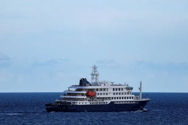 The cruise ship MV Hondius, affected by a hantavirus outbreak, leaves the port of Granadilla de Abona, in Tenerife, Spain, May 11, 2026. (Reuters)