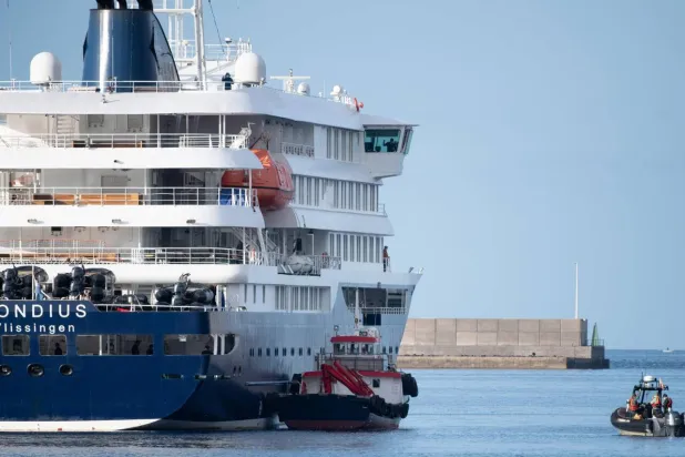 Six passengers who sailed on a hantavirus-affected cruise are set to fly to Australia in protective gear. JORGE GUERRERO / AFP/File
