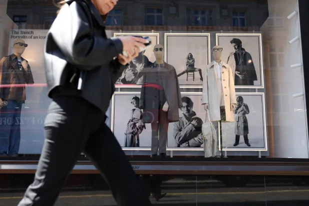 People walk past the Burberry store on Regent Street in central London on May 12, 2026. (Photo by Adrian DENNIS / AFP)