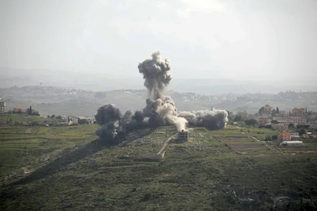 Smoke rises from the site of an Israeli airstrike that targeted the southern Lebanese village of Deir El Zahrani on May 13, 2026. (Photo by Kawnat HAJU / AFP)