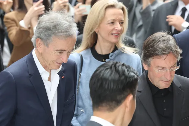 Bernard Arnault (L), chair of the world's largest luxury house LVMH, and Delphine Arnault (C), his daughter and CEO of Christian Dior Couture, arrive at Shinsegae Inc.'s flagship department store in Seoul, South Korea, 11 May 2026, to visit The Louis Vuitton Visionary Journeys Seoul.  EPA/YONHAP