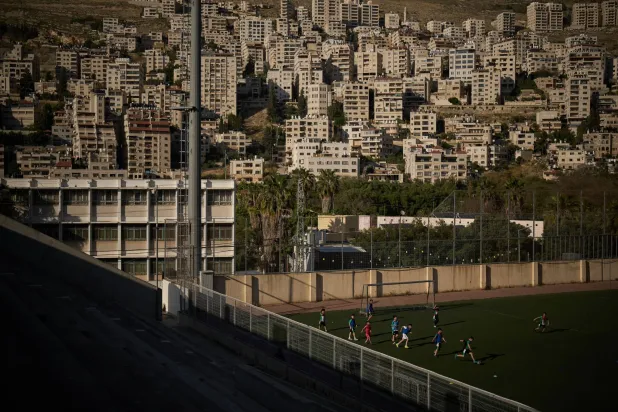 Palestinian boys from a local soccer academy run after the ball during a training session at the municipal stadium of the West Bank City of Nablus, Thursday, May 7, 2026. (AP Photo/Leo Correa)